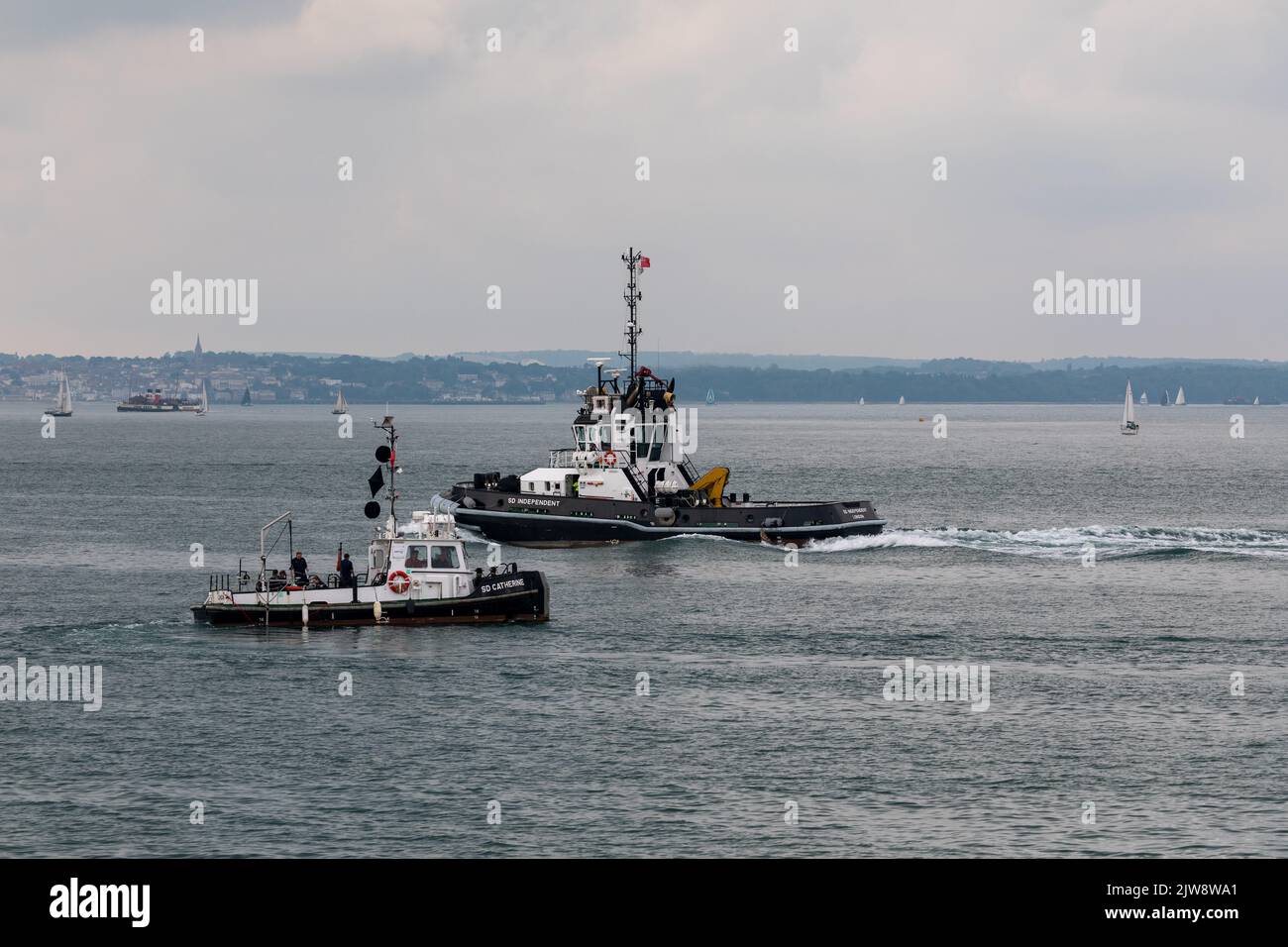 Serco vessel's operating in the Solent. Serco provides support service to the military including the Royal Navy Stock Photo