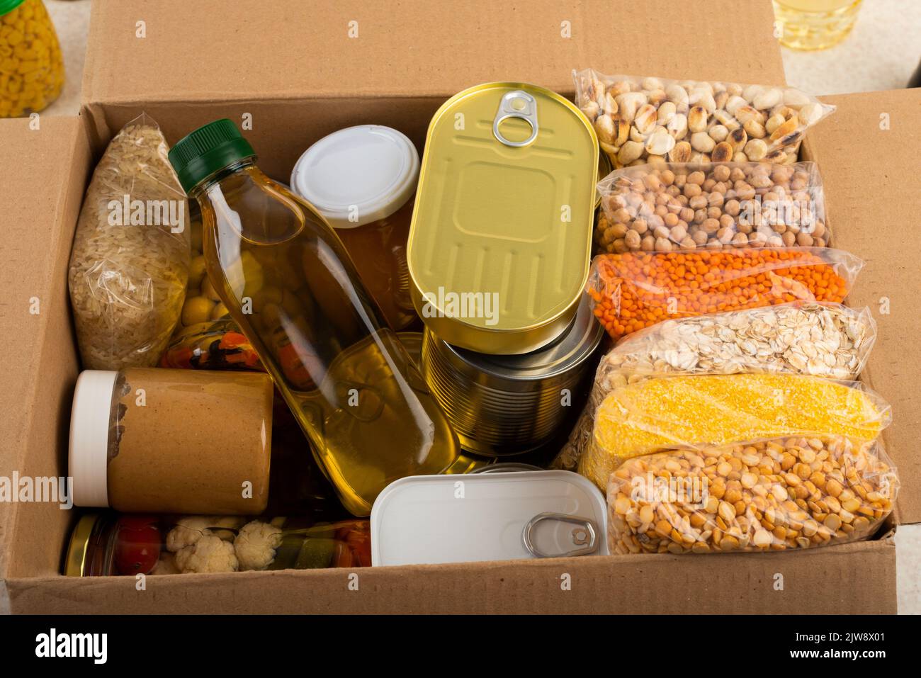 Survival set of nonperishable foods in carton box Stock Photo