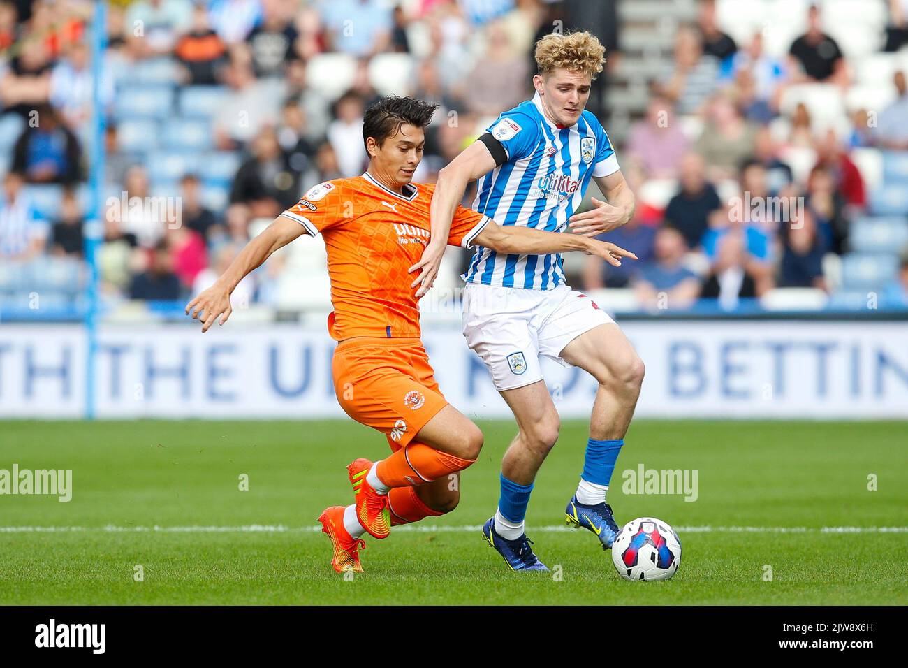 Huddersfield, UK. 04th Sep, 2022. Kenny Dougall #12 of Blackpool and Jack Rudoni #22 of Huddersfield Town during the Sky Bet Championship match Huddersfield Town vs Blackpool at John Smith's Stadium, Huddersfield, United Kingdom, 4th September 2022 (Photo by Ben Early/News Images) in Huddersfield, United Kingdom on 9/4/2022. (Photo by Ben Early/News Images/Sipa USA) Credit: Sipa USA/Alamy Live News Stock Photo