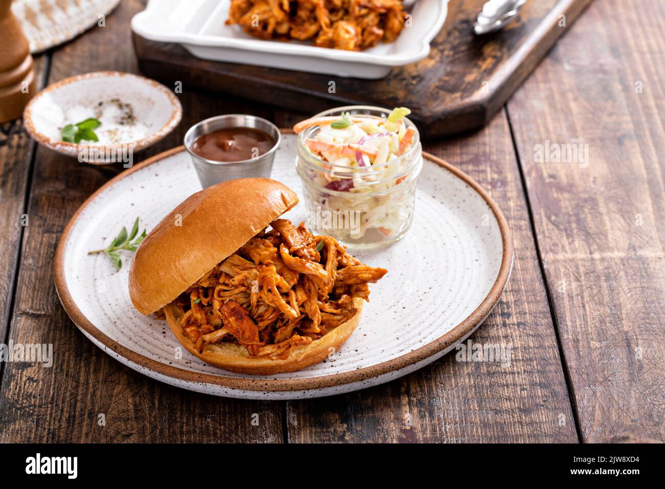Pulled bbq chicken on a brioche bun Stock Photo Alamy