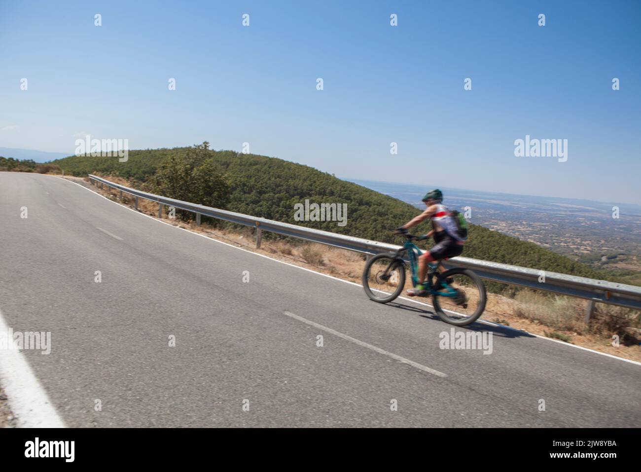Senior Cyclist Speeding Down The CC 139 Winding Road Low Motion Shot senior-cyclist-speeding-down-the-cc-139-winding-road-low-motion-shot