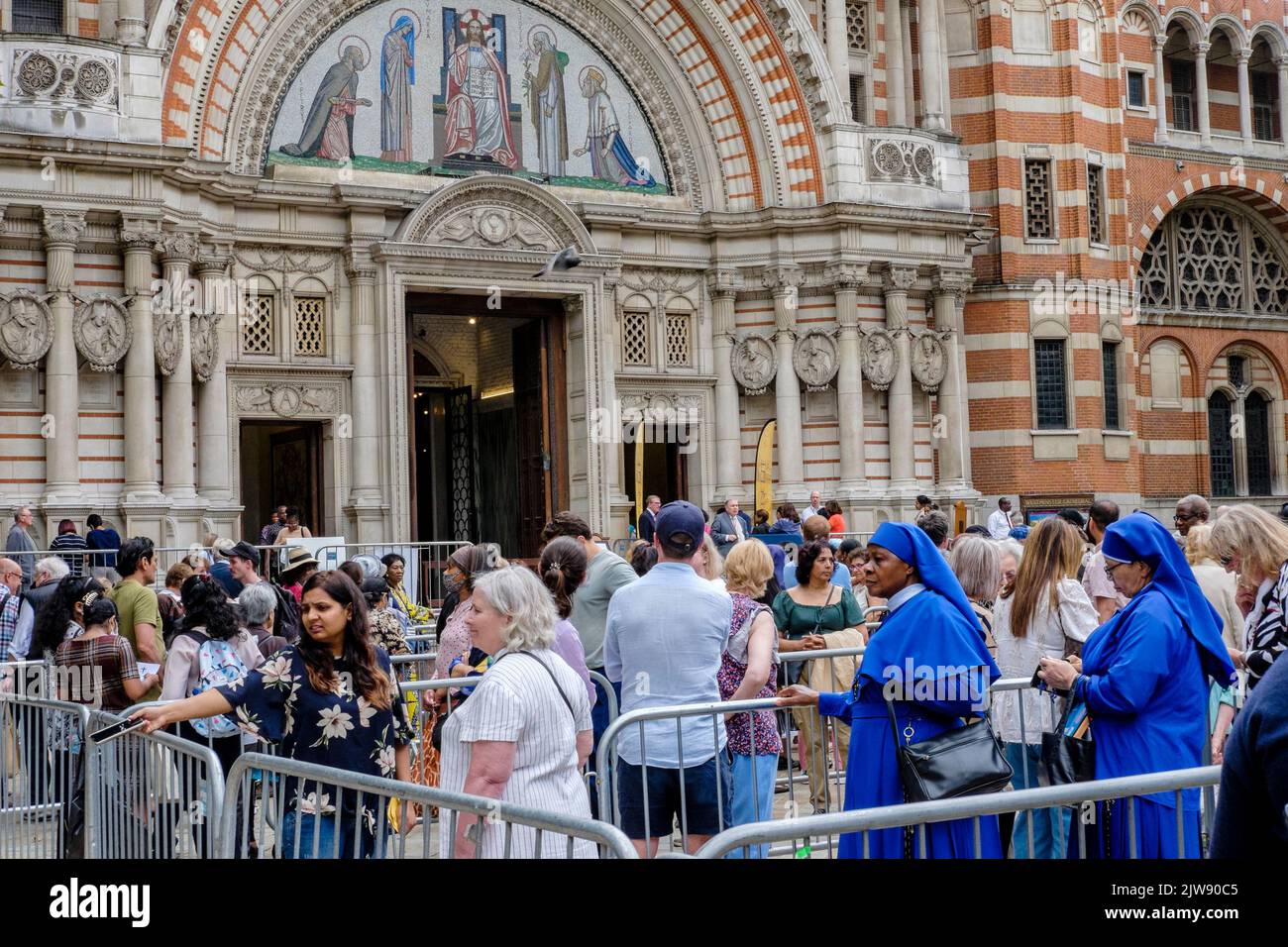 London, UK. 3rd September 2022, Religious devotees queue outside Westminster Cathedral to view the relics of St. Bernadette for the first time in the UK during a tour of England, Scotland and Wales throughout September and October 2022. Stock Photo