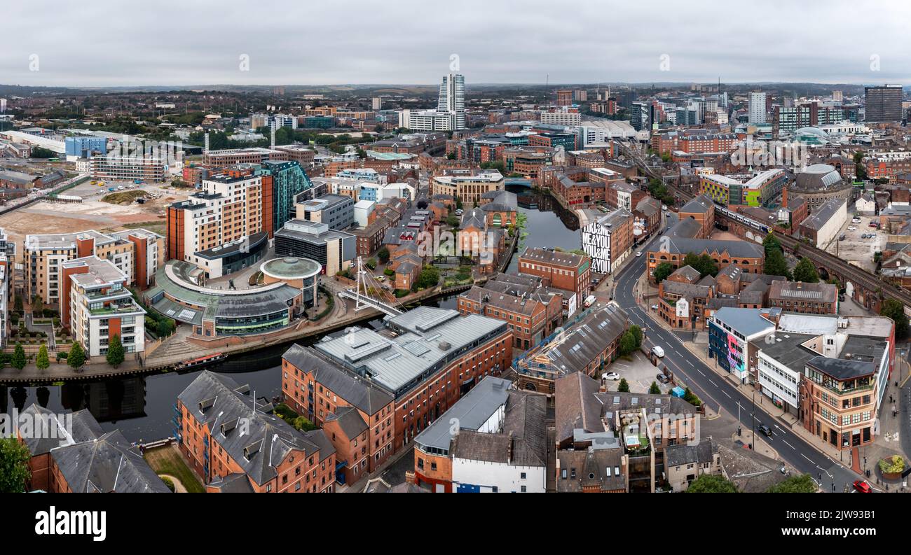 LEEDS, UK - SEPTEMBER 2, 2022.  An aerial panorma view of Leeds cityscape skyline with Leeds Dock and Robert's Whaf on the Leeds to Liverpool canal Stock Photo