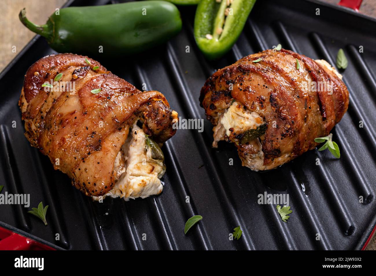 Jalapeno popper chicken wrapped in bacon and stuffed with jalapeno Stock Photo