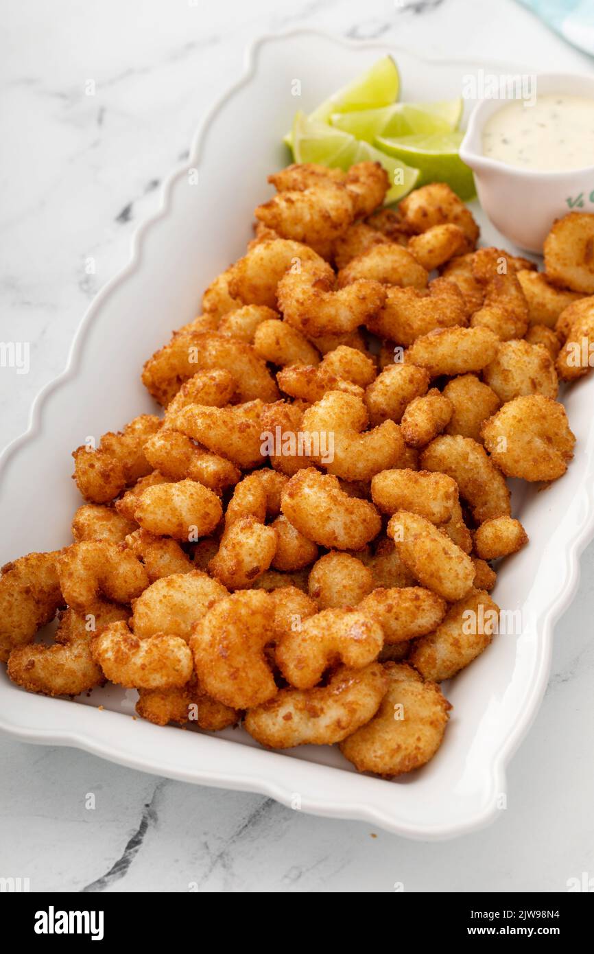 Coconut popcorn shrimp, appetizer idea with a dipping sauce Stock Photo