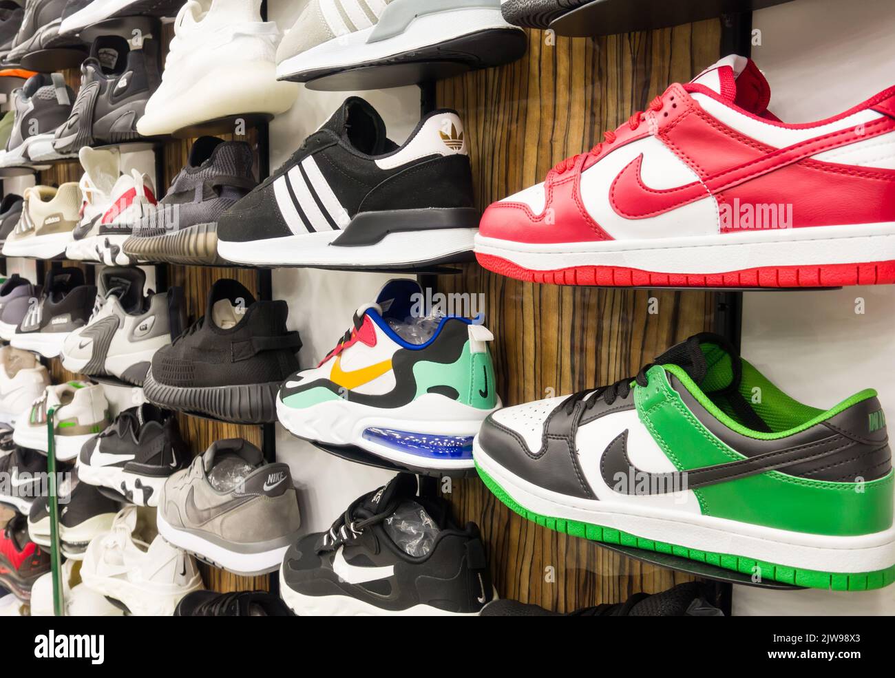 Berlin, Germany - March 12, 2022: Different brand shoes in a retail shop. Stock Photo