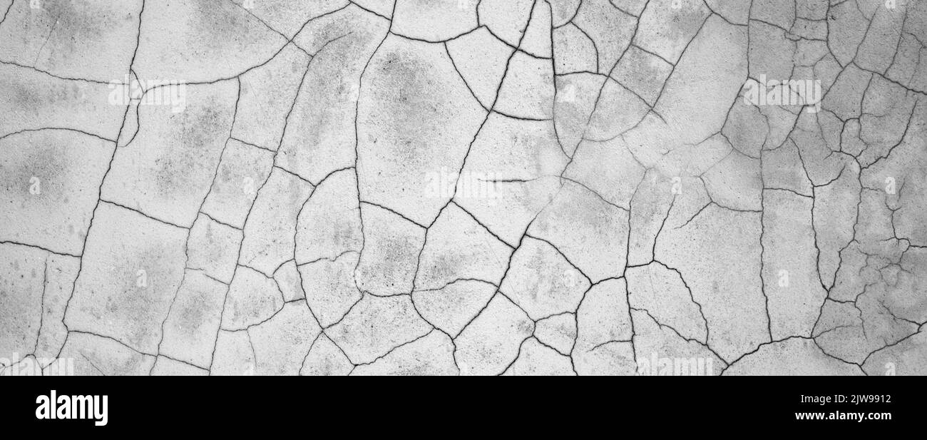 Grey background. Detailed photo of wall with cracks Stock Photo