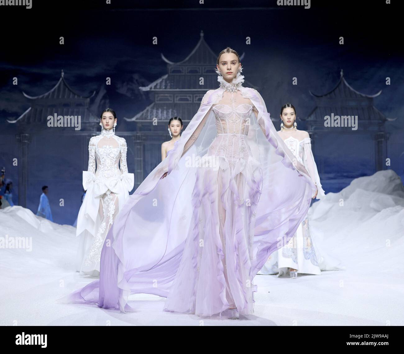 Beijing, China. 4th Sep, 2022. Models present creations by designer Xiong Ying during the opening fashion show of China Fashion Week S/S 2023 in Beijing, capital of China, Sept. 4, 2022. The fashion week kicked off here on Sunday. Credit: Chen Jianli/Xinhua/Alamy Live News Stock Photo