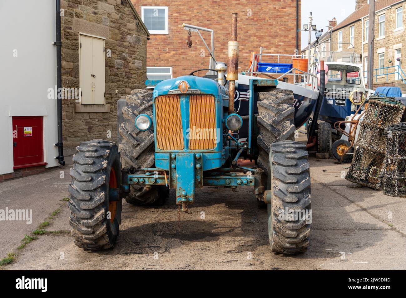 Front view of a vintage 1960s blue tractor - the Fordson Super Major, in Newbiggin by the Sea, Northumberland, UK. Stock Photo