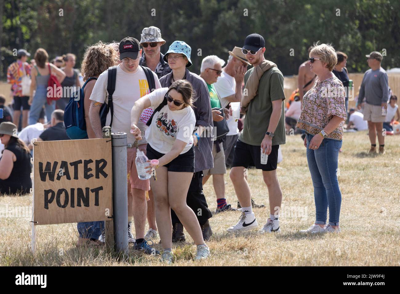Festival goers stock up on water at END OF THE ROAD music festival, held at Larmer Tree Gardens, Wiltshire, England, UK Stock Photo