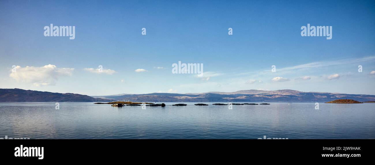 Fish farm off the coast of Portavadie on Loch Fyne on the west coast of Scotland looking like the Loch Ness monster Stock Photo