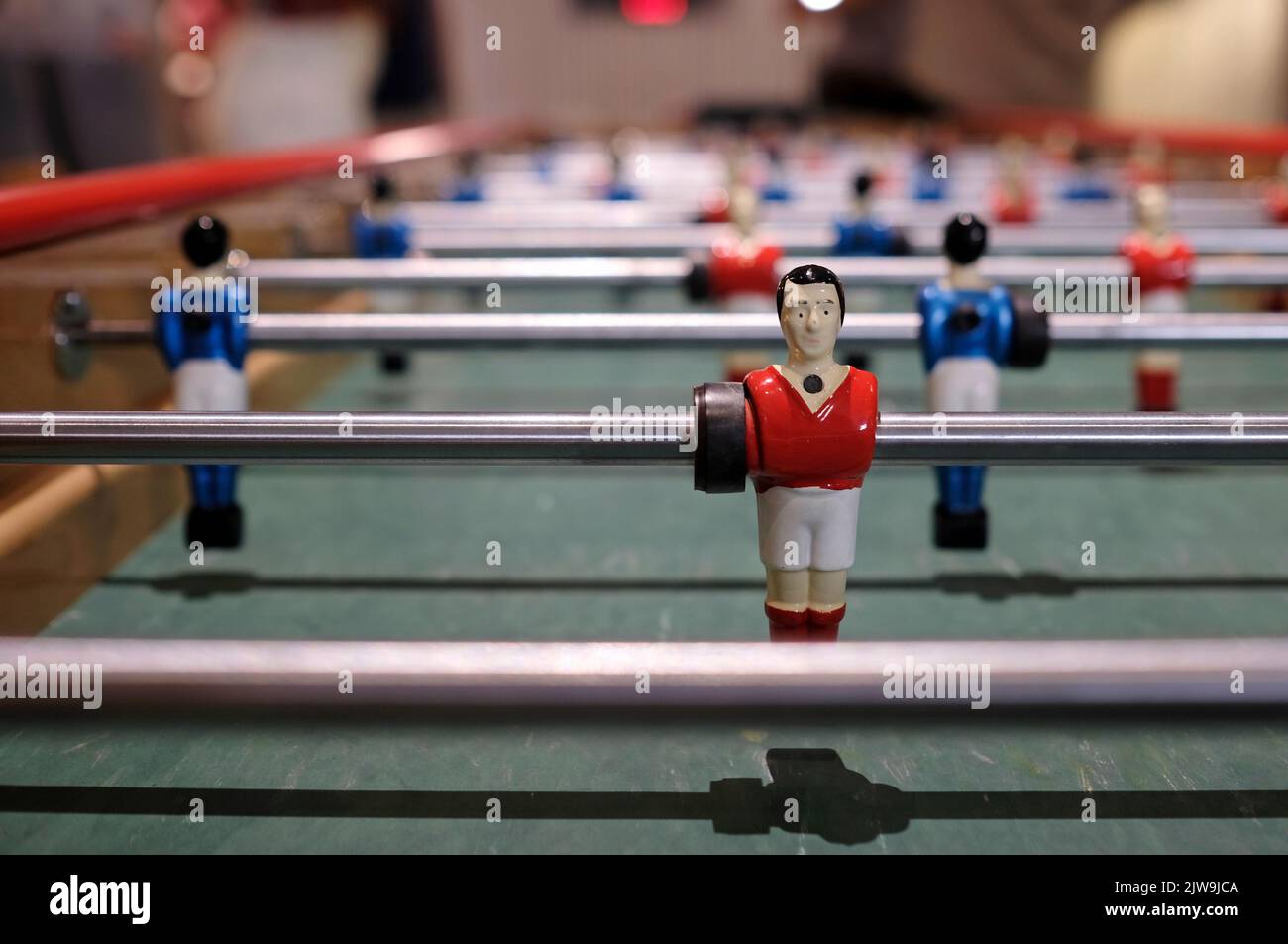 Figurine of an extralong foosball table or table football Stock Photo