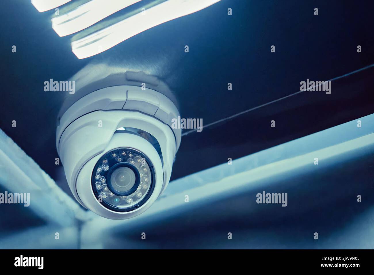 Indoor surveillance security camera in the elevator of a residential building. CCTV camera on an