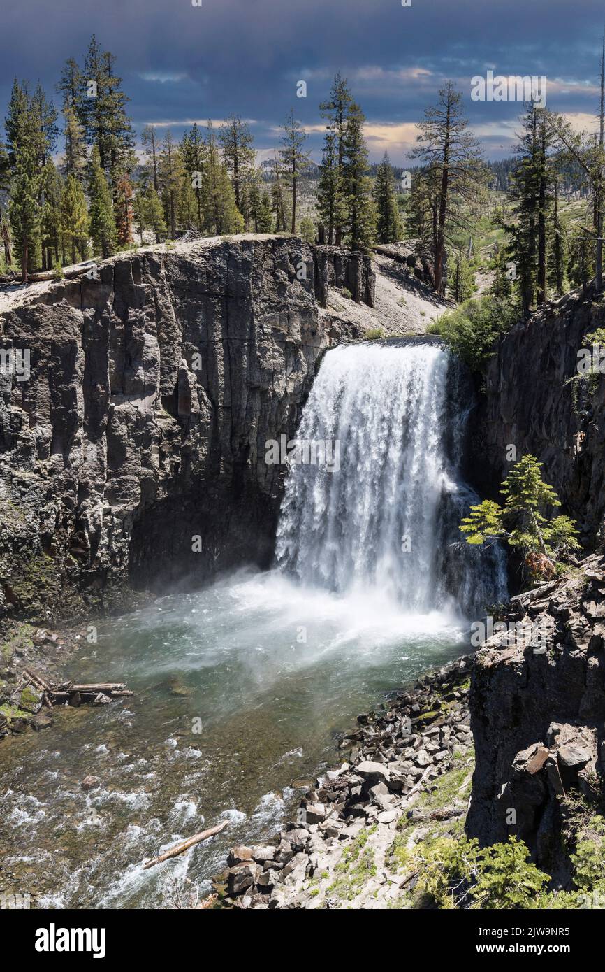 Vertical view of Rainbow Falls near Devils Postpile, Reds Meadow and Mammoth Lakes in the California Sierra Nevada Mountains. Stock Photo