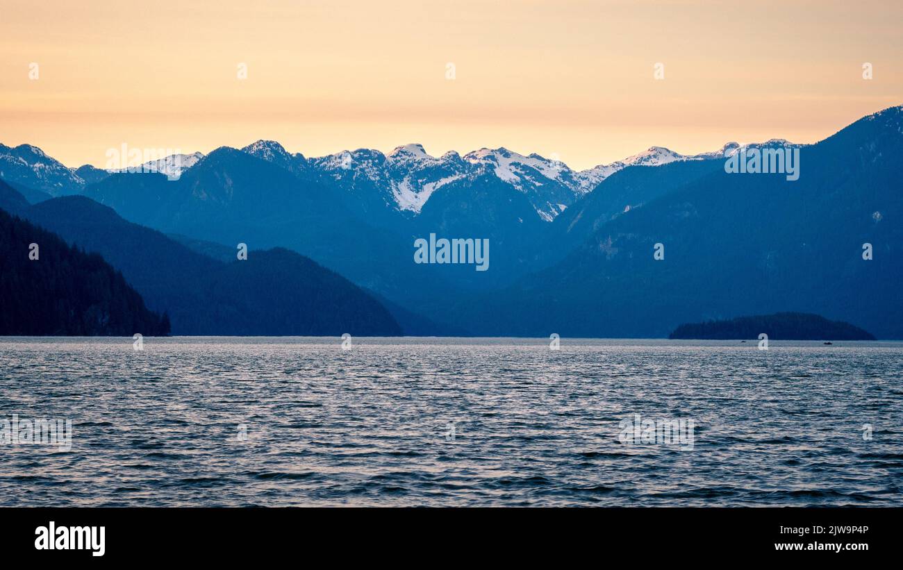 The mountains that can be seen across Pitt Lake during golden hour and