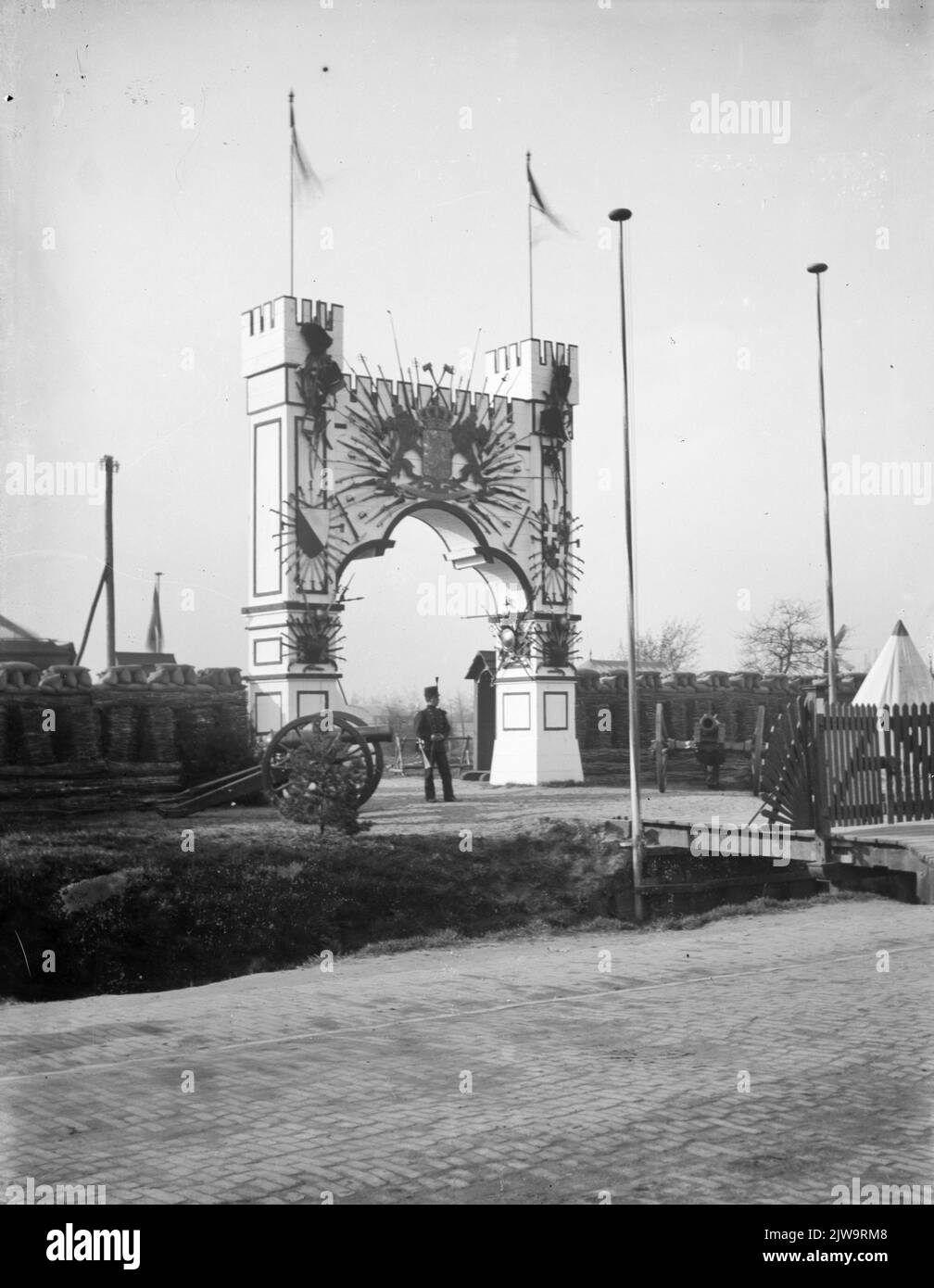 Image of a decorated gate at an unknown (military) site, possibly on the sugar site on the Leidseweg in Utrecht, in connection with the 100-year commemoration of the restoration of Dutch independence in 1913. Stock Photo