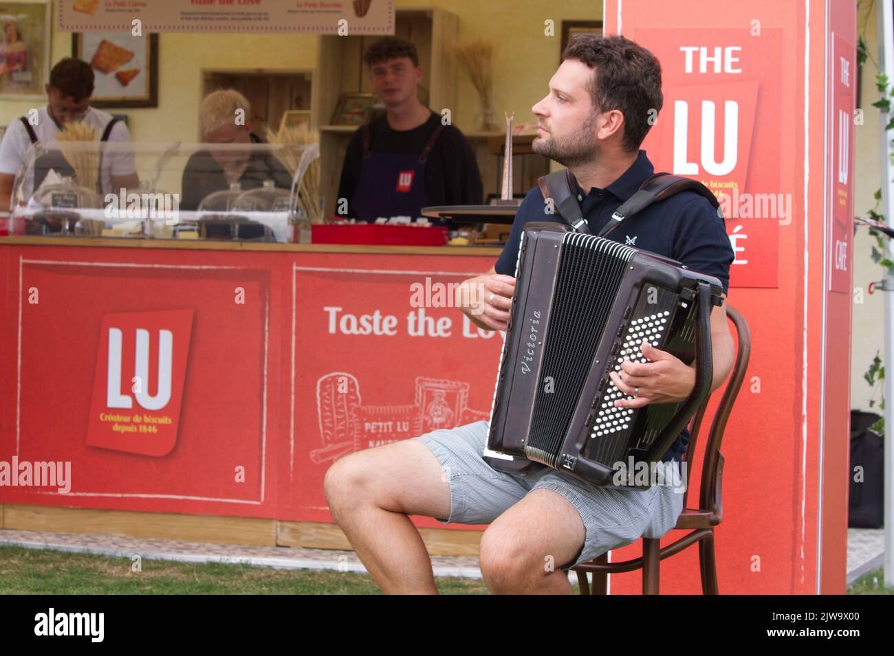 Accordion player at the LU Cafe stand at the inaugural Gardeners World Autumn Fair 2022 held at Audley End in Essex. Stock Photo
