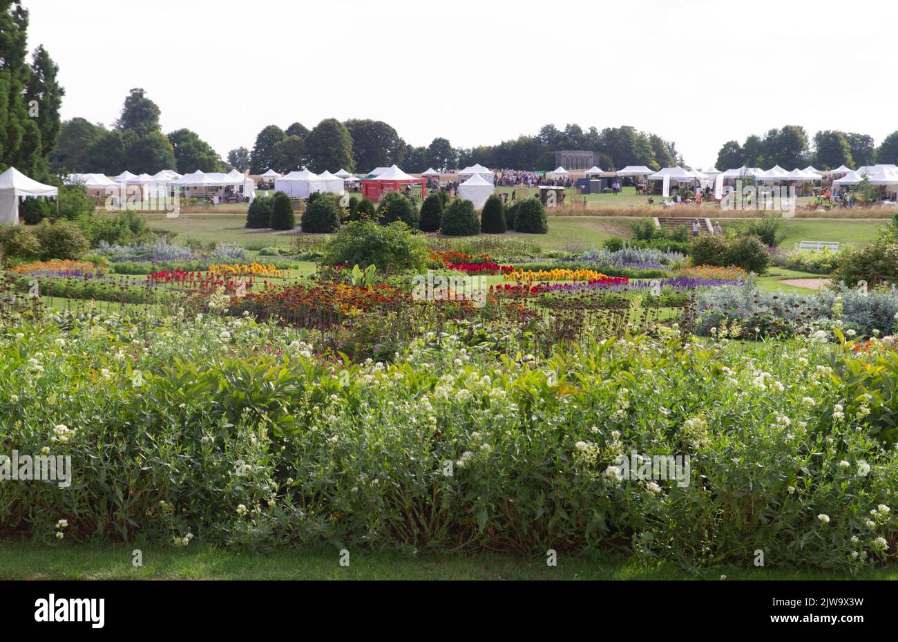 View overlooking the Parterre garden to the trade stands beyond at the inaugural Gardeners World Autumn Fair 2022 held at Audley End in Essex. Stock Photo
