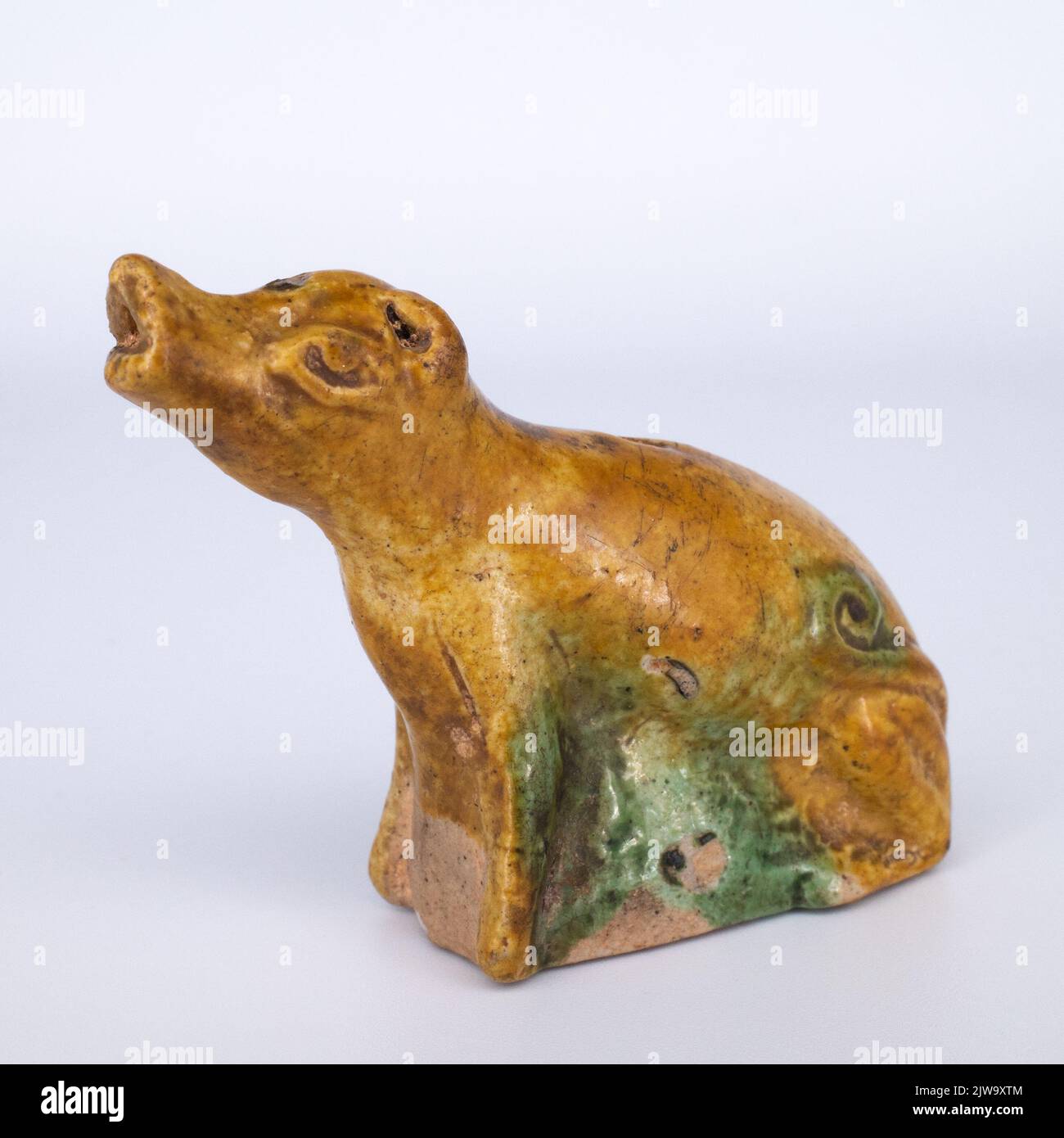 Antique Chinese Sancai Glazed Biscuit Model of a Howling Dog or Wolf Stock Photo