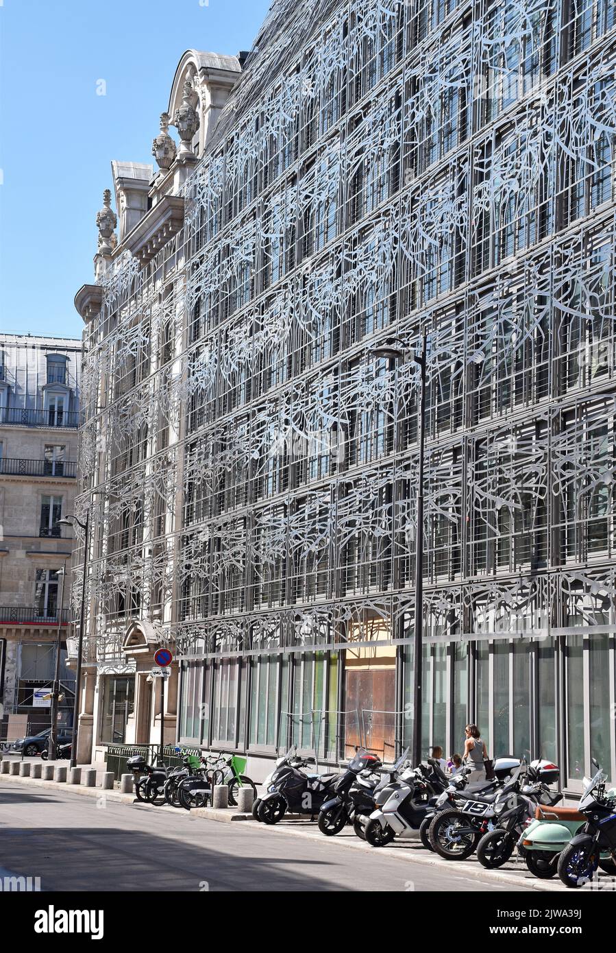 Buildings in an entire Paris street block covered with a metal framework, of filigree steel strips in abstract arabesque patterns on all upper floors Stock Photo