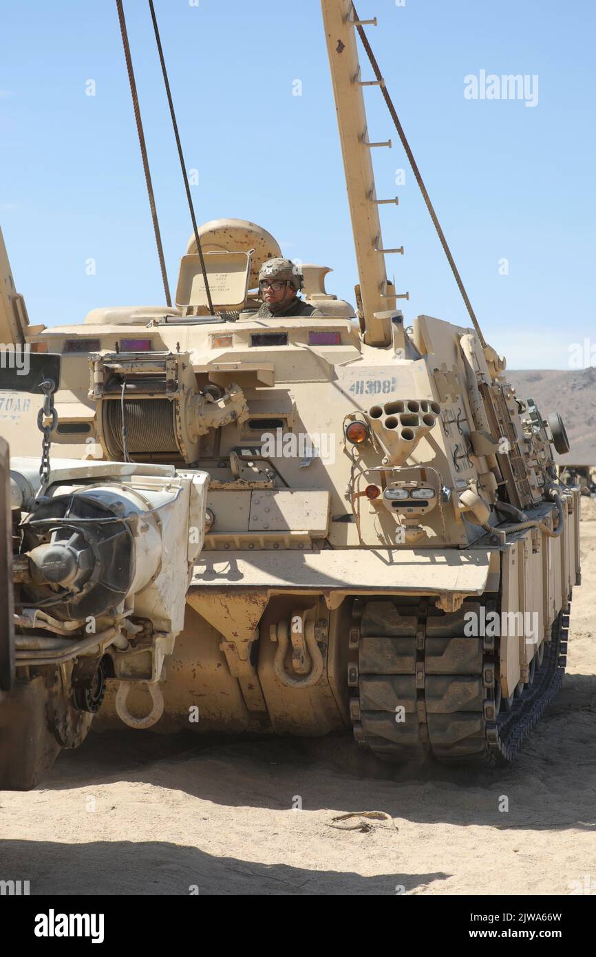 A U.S. Soldier assigned to 2nd Battalion, 70th Armored Regiment, 2nd Armored Brigade Combat Team, 1st Infantry Division uses a M88 Hercules Recovery Vehicle during Decisive Action Rotation 22-09 at the National Training Center, Fort Irwin, Calif., Aug. 14, 2022. (U.S. Army photo by Sgt. Ryan Gosselin, Operations Group, National Training Center) Stock Photo