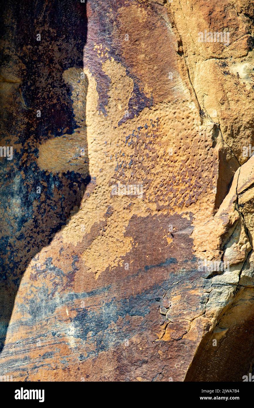 Petroglyphs rock art in Legend Rock State Archaeological Site, Wyoming - A carved sandstone zoomorphic panel of a bear-like creature with big ears cre Stock Photo