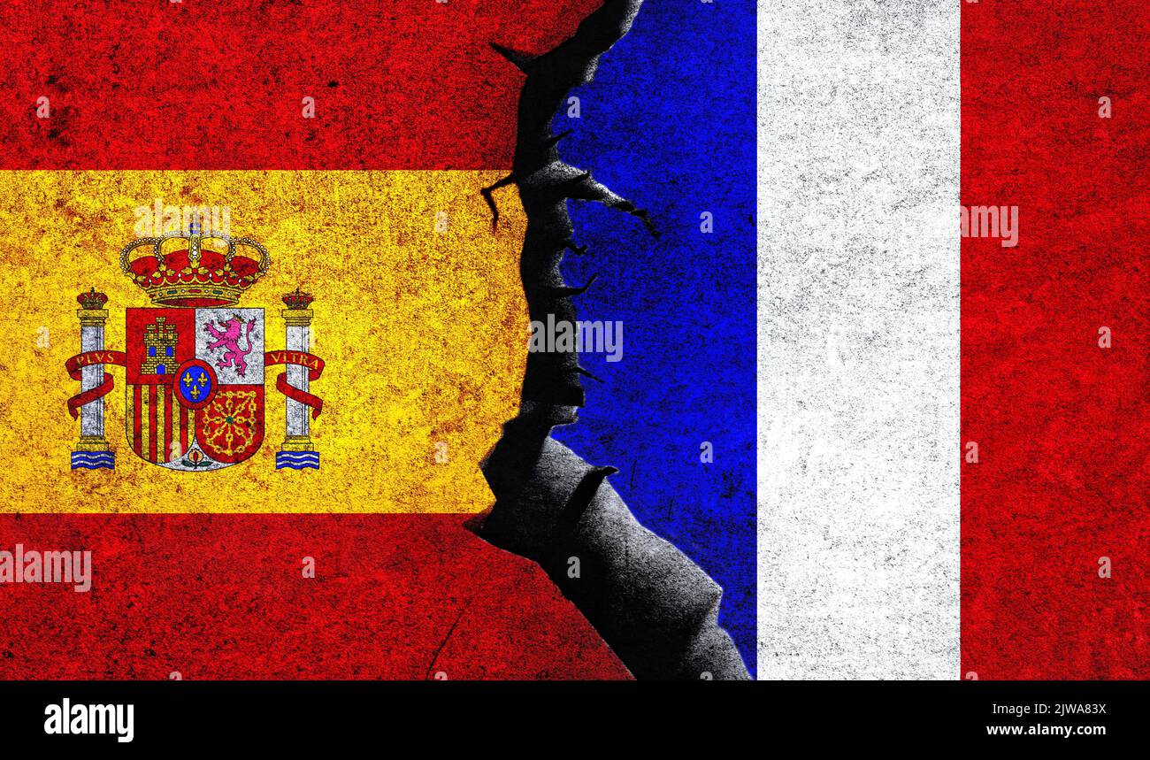 Spain and France flag on a wall with a crack. Spain France relations
