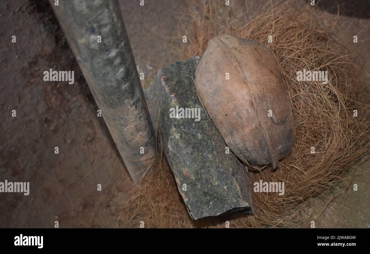 Coconut Husk lying on the ground at hut selling Cinnamon. Sri Lanka. Stock Photo