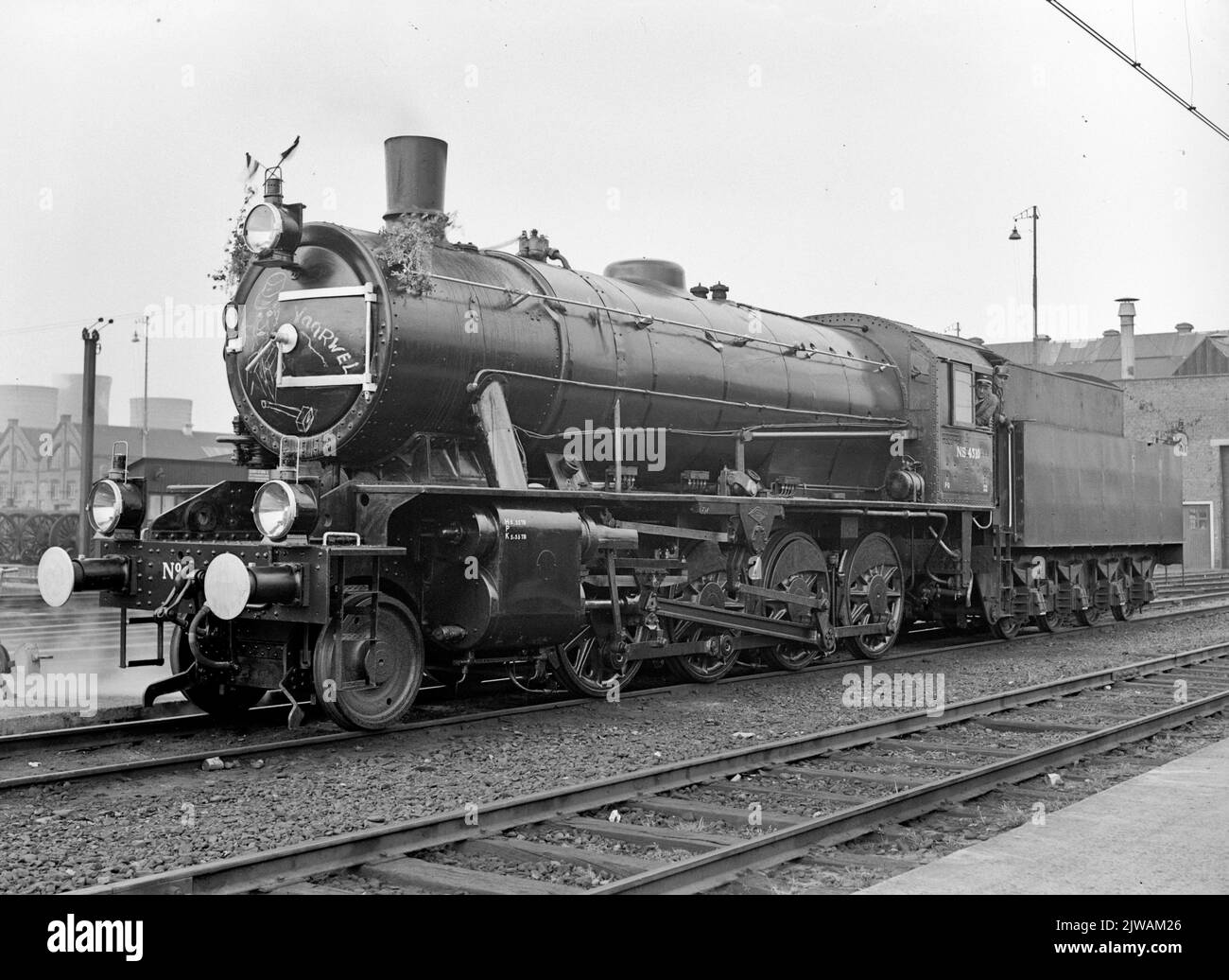 Image of steam locomotive no. 4310 (series 4300/4400/4500, 'austerities', ex War Department no. 70863) of the N.S. at the central workshop in Tilburg, with decorations because this was the last steam locomotive that in the workshop in Tilburg. Stock Photo