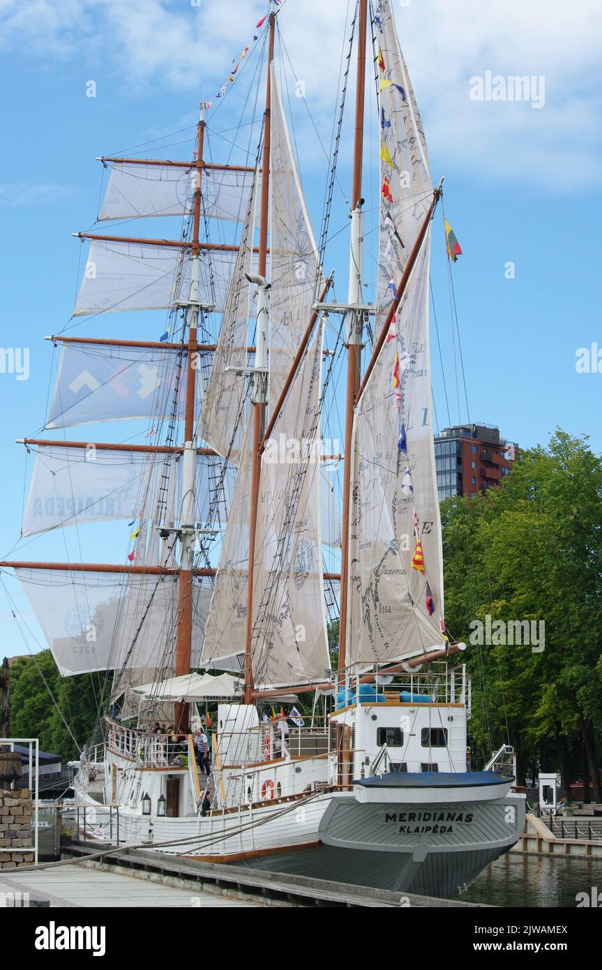 KLAIPEDA, LITHUANIA - 09 August 2022 Sailboat Meridianas former training ship, currently a restaurant on the embankment of the river Dane Stock Photo