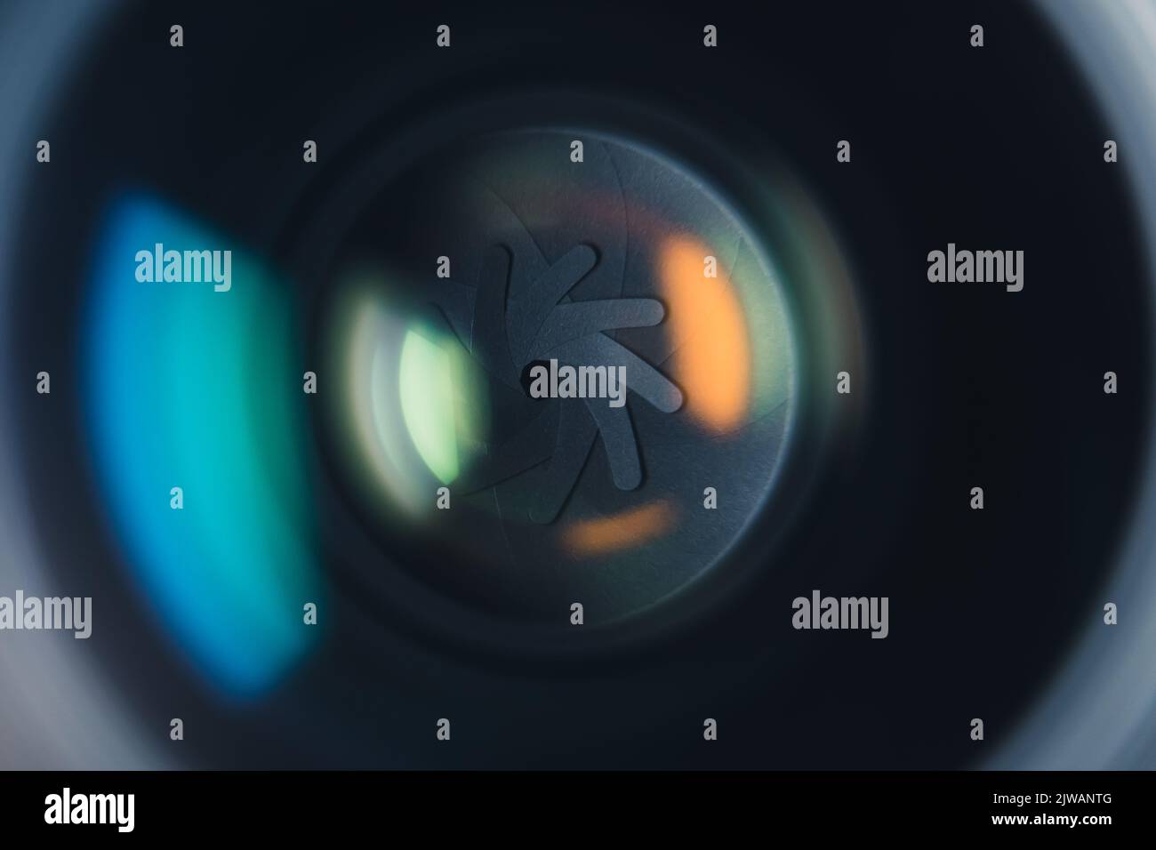 Closeup professional camera lens with color reflections. Aperture