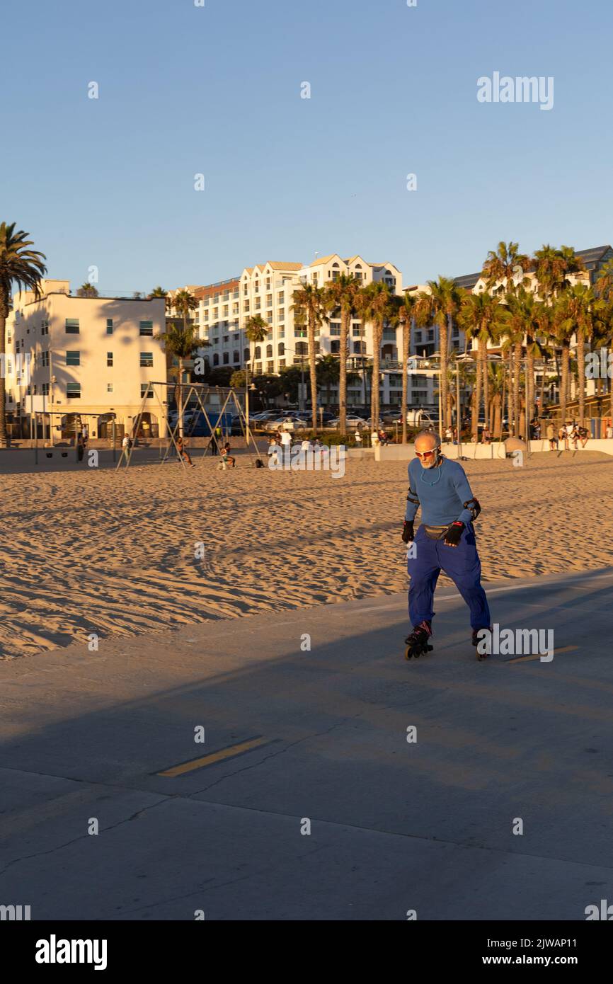Senior citizen roller blading in Santa Monica Stock Photo