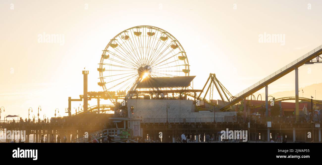 Ferris wheel on Santa Monica Pier at sunset Stock Photo