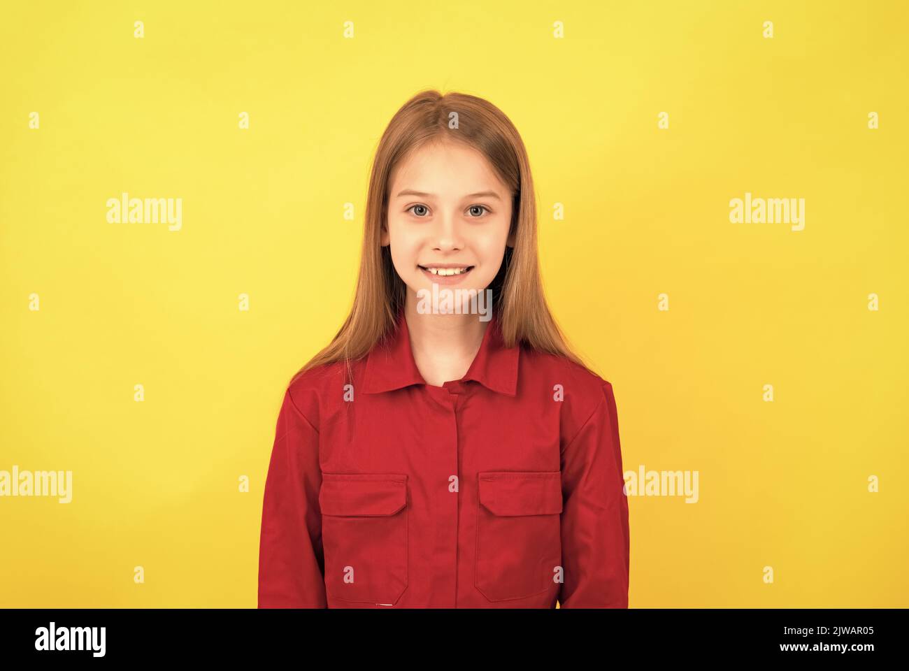 happy teen kid with cute face on yellow background Stock Photo