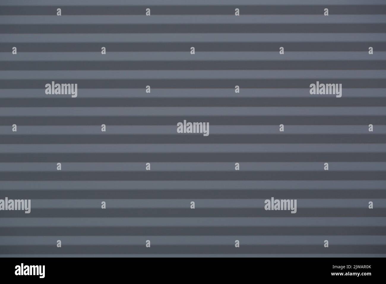 Black clear background with corrugated iron in horizontal orientation. Stock Photo
