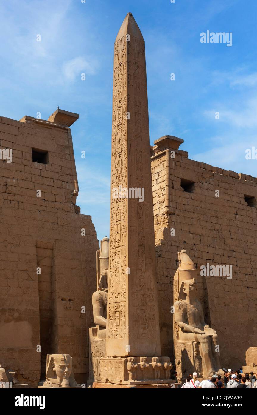 The entrance to Luxor temple with the remaining 25m pink granite obelisk (the other now stands in Place de Concorde, Paris) Luxor, Egypt Stock Photo
