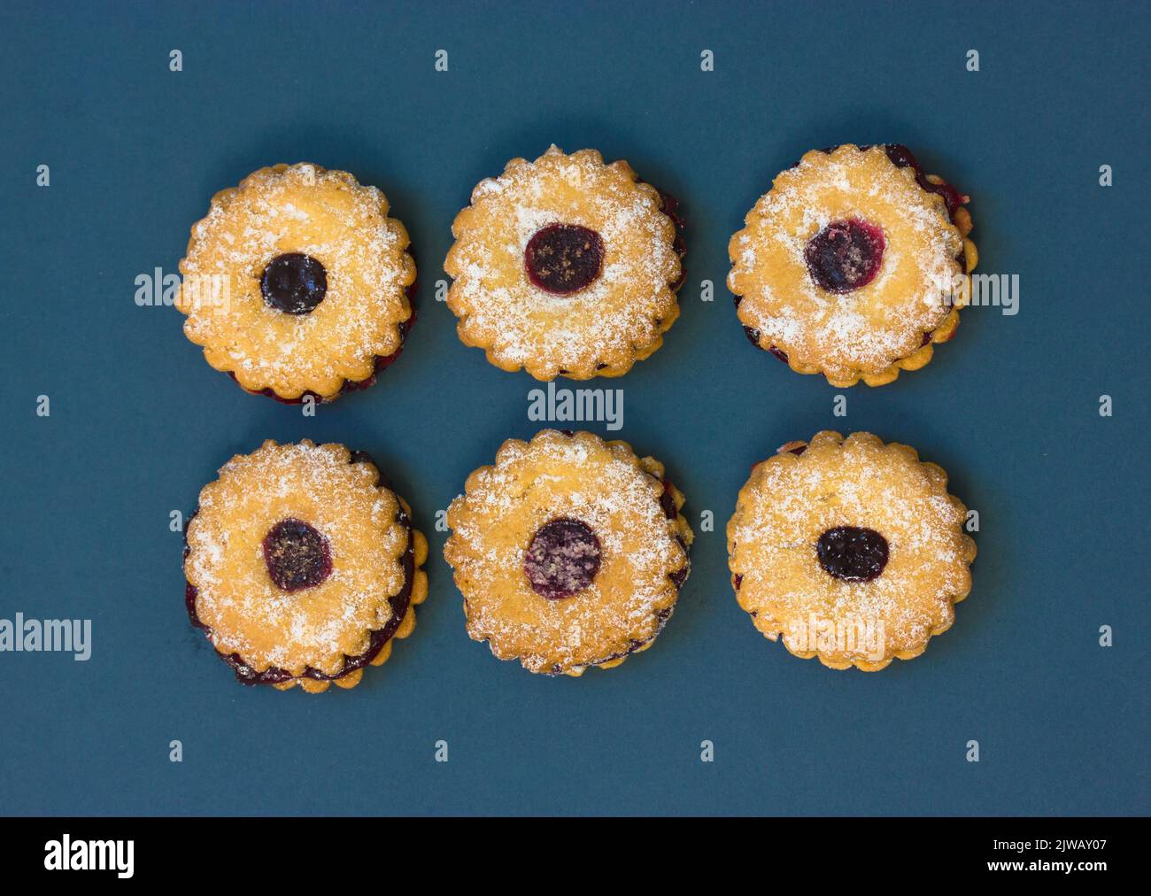 Crumbly shortbread biscuit cookies in the form of flowers on white