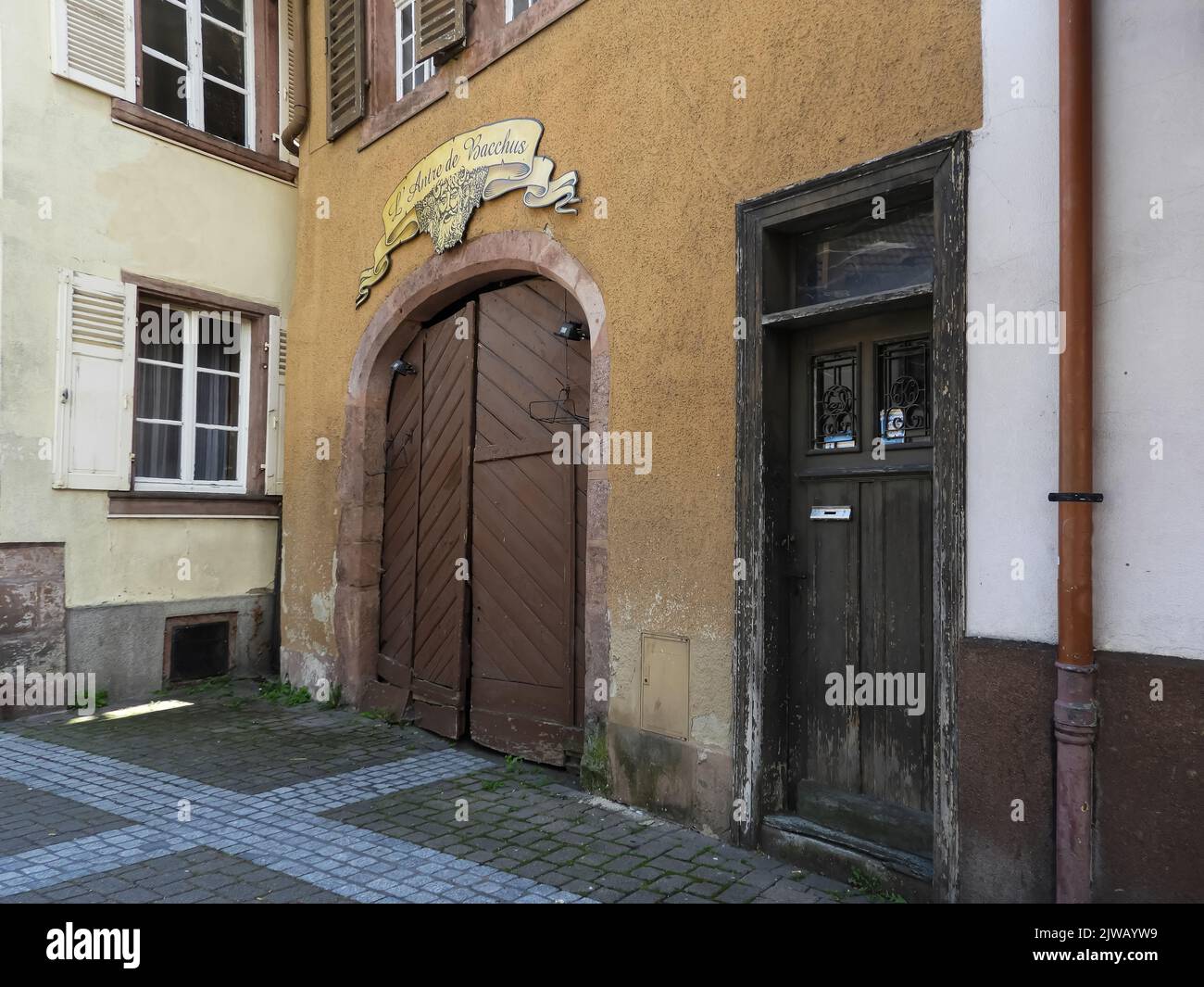 Wine cellar doorway in the Alsace region of France with a sign above the entrance Stock Photo