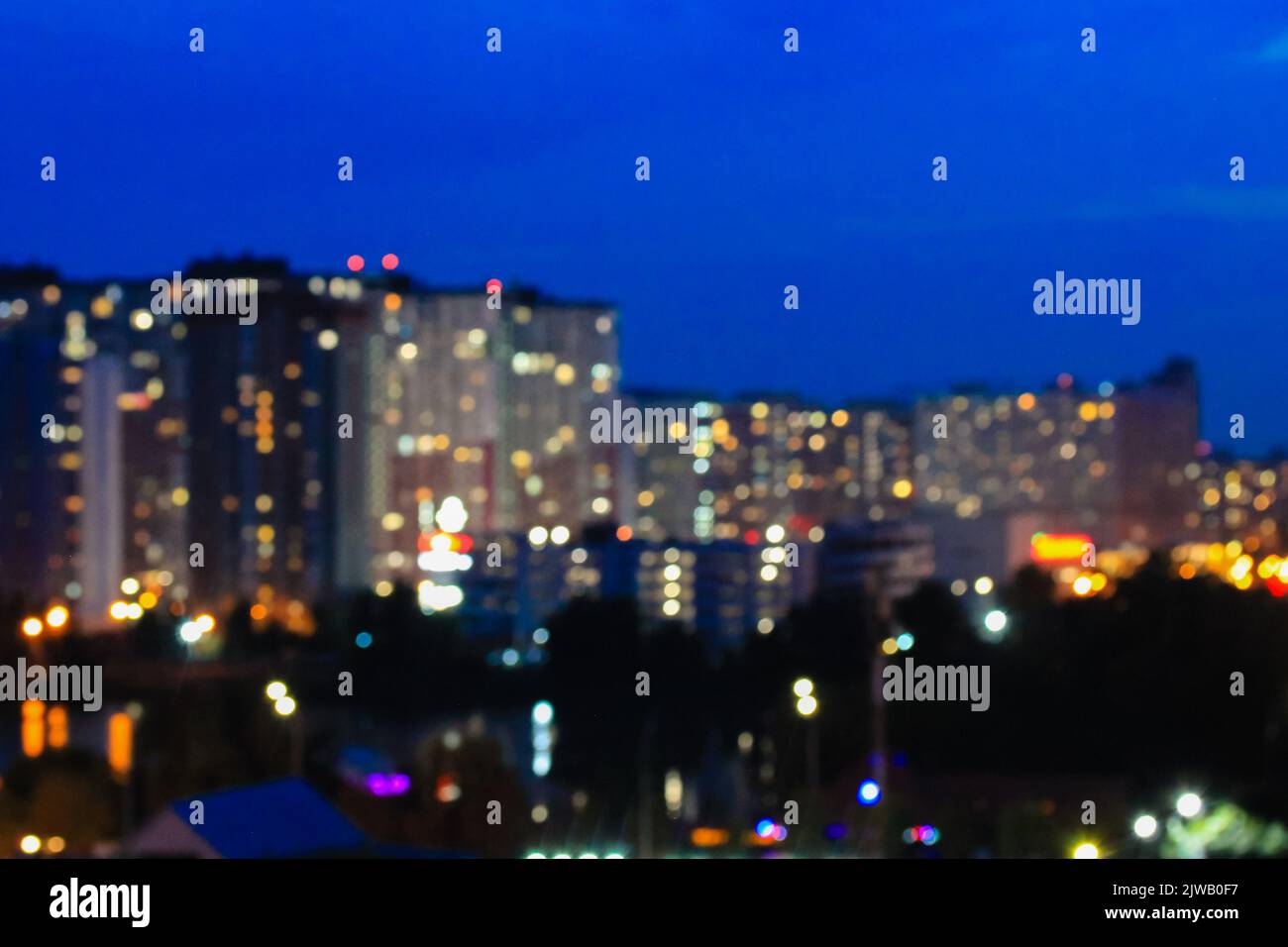 Panorama of a big city at night with a view of high-rise buildings on a ...