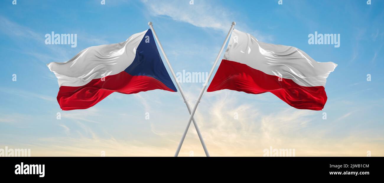 two crossed flags poland and Czech republic waving in wind at cloudy ...