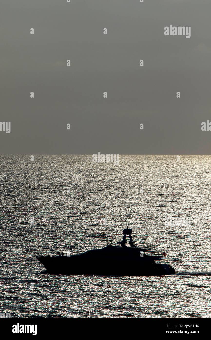 Silhouette of a modern yacht in the Mediterranean Sea in Ibiza Stock Photo