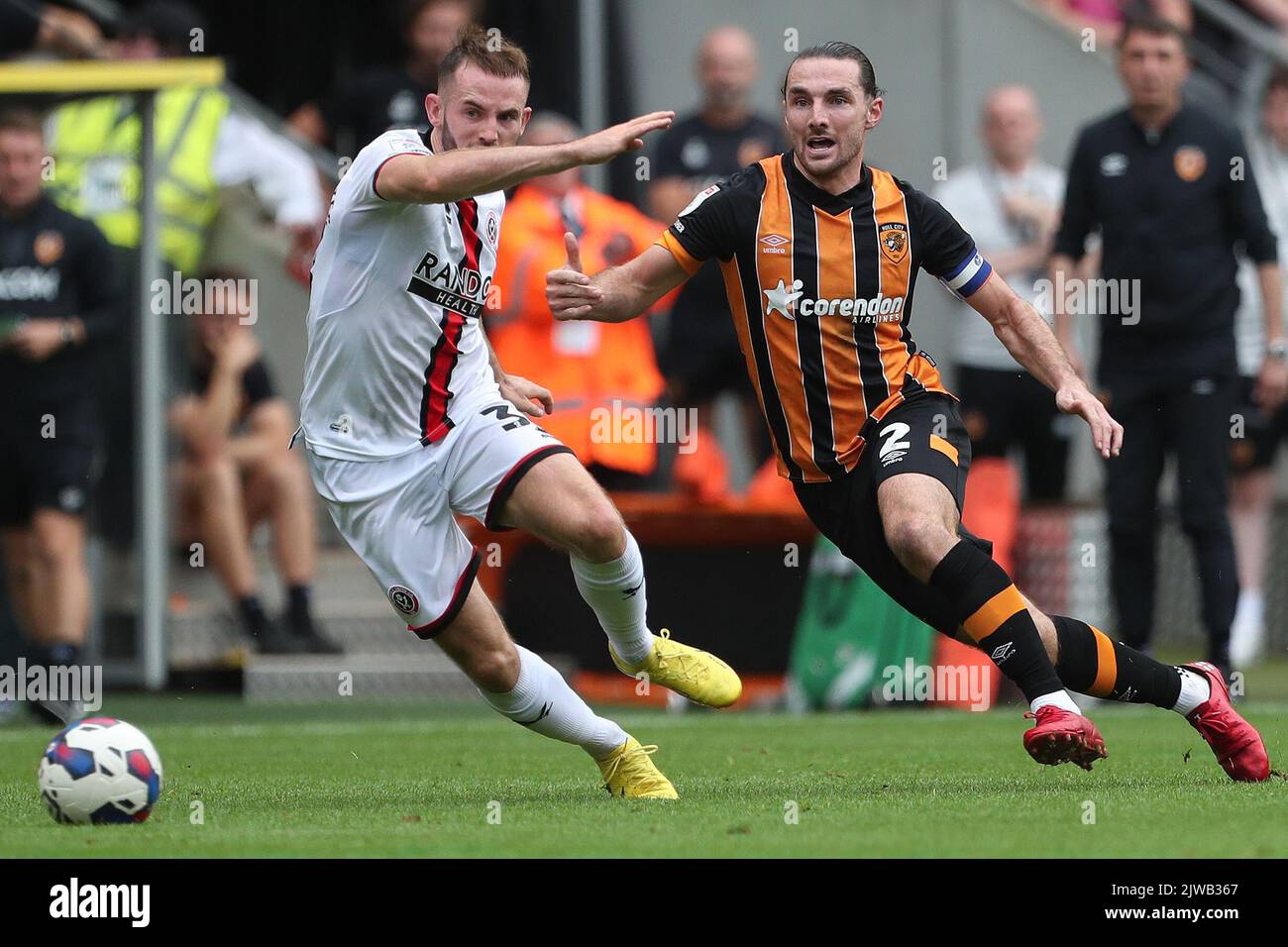 Hull, UK. 4th September, 2022. Rhys Norrington-Davies of Sheffield United in action with Hull City's Lewis Coyle during the Sky Bet Championship match between Hull City and Sheffield United at the MKM Stadium, Kingston upon Hull on Sunday 4th September 2022. (Credit: Mark Fletcher | MI News) Credit: MI News & Sport /Alamy Live News Stock Photo