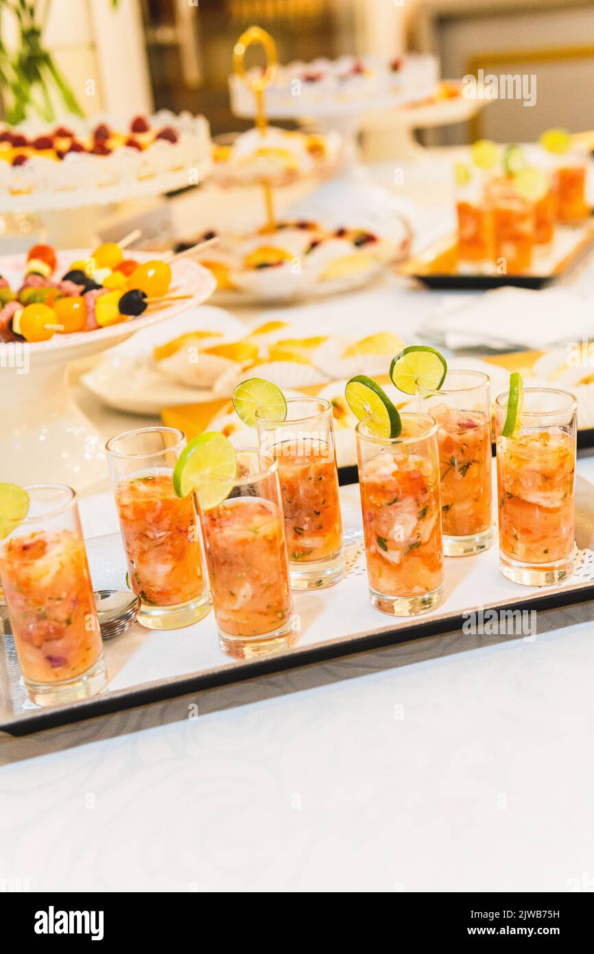 Selective focus of a tray with glasses with shrimp cocktail at a food ...
