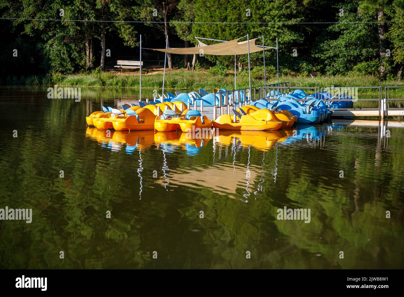 Yellow and Blue pedal boats floating in a lake at Shelby Farms Park