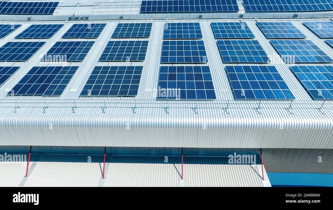 Top view Solar Cell on Warehouse Factory. Solor photo voltaic panels