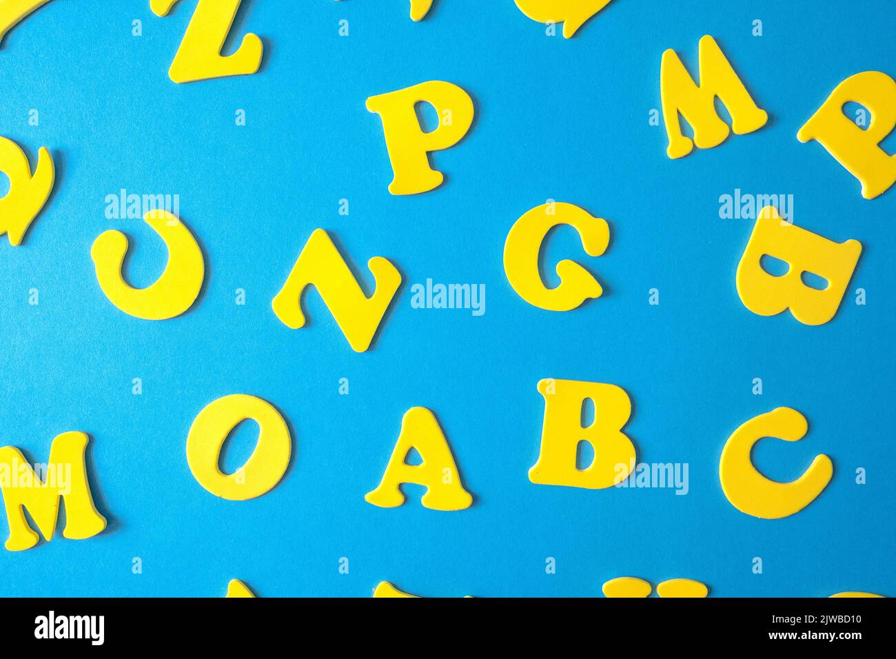 Colorful letters of the alphabet on a blue background elementary