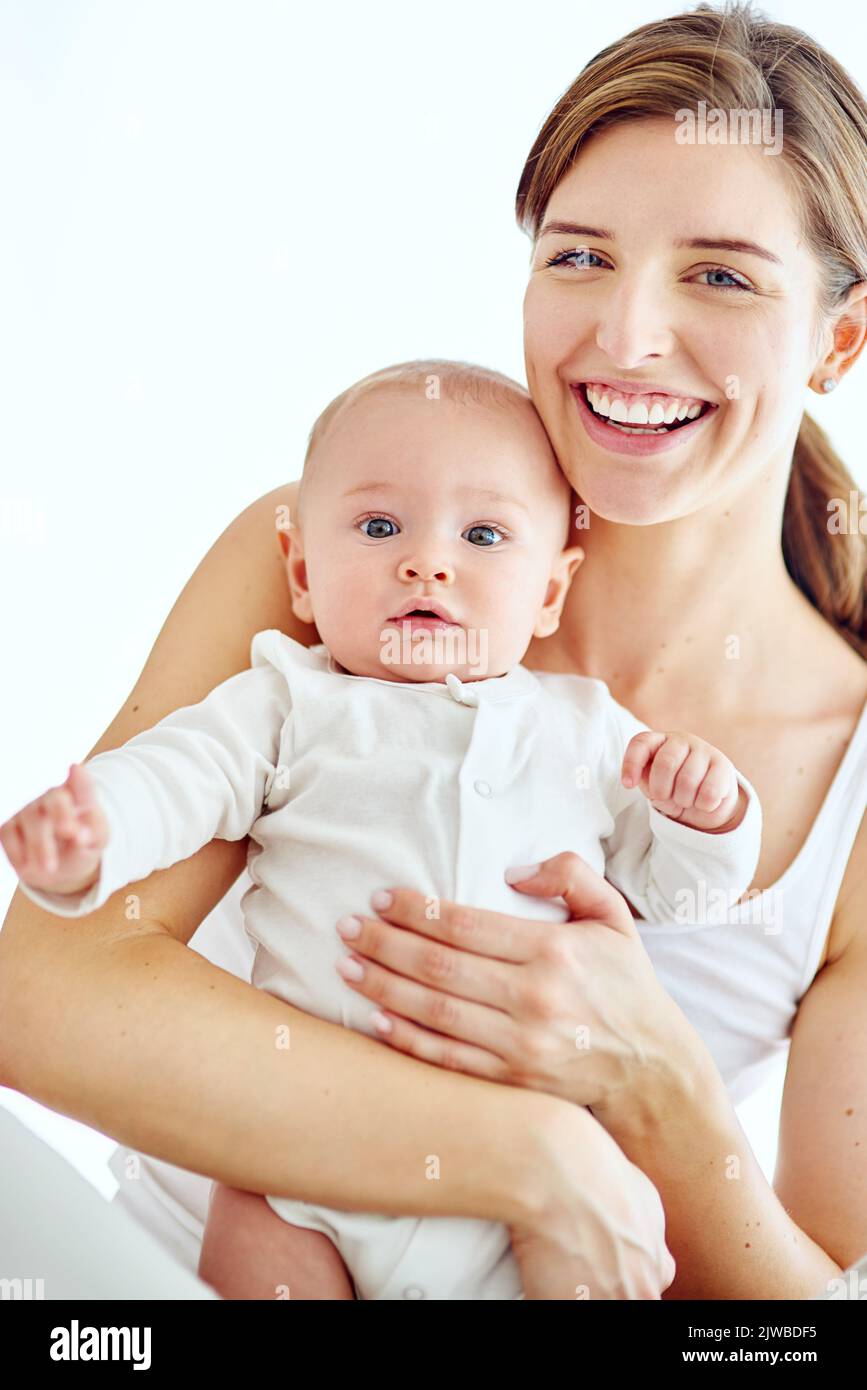 Im so proud to be his mom. Portrait of a loving mother carrying her baby boy at home. Stock Photo