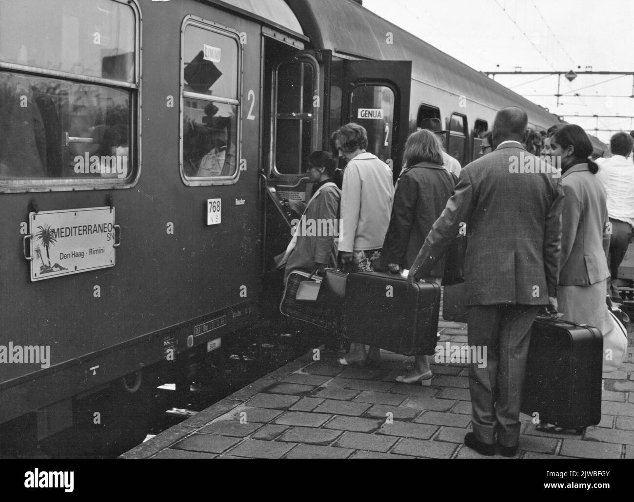 Image of boarding train passengers in the Mediterraneo from The Hague to Rimini at the N.S. station Venlo in Venlo. Stock Photo