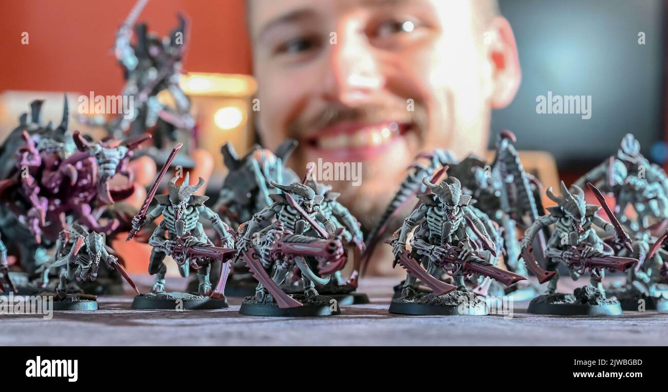Bauschlott Neulingen, Germany. 29th Aug, 2022. Tim Winkler shows Warhammer game figures painted by him. Tim Winkler paints these figures himself in hours of work. He is one of a large number of people who are not only interested in tabletop games in general - strategy games that are played on a tabletop and in which players compete against each other with groups of miniatures - but who also paint the miniatures themselves. (to dpa: 'It's all in the details - Painters of mini figures ') Credit: Uli Deck/dpa/Alamy Live News Stock Photo