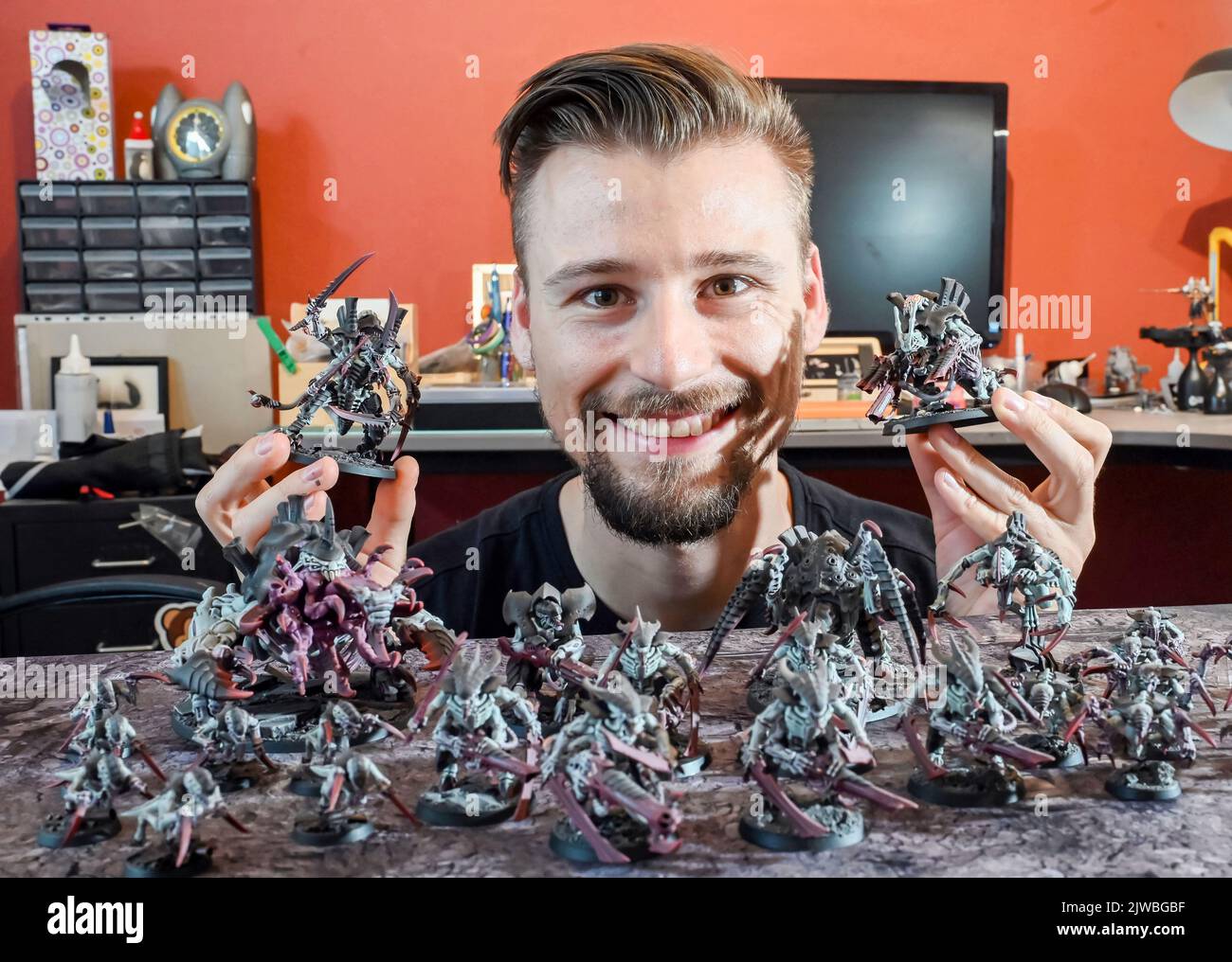 Bauschlott Neulingen, Germany. 29th Aug, 2022. Tim Winkler shows Warhammer game figures painted by him. Tim Winkler paints these figures himself in hours of work. He is one of a large number of people who are not only interested in tabletop games in general - strategy games that are played on a tabletop and in which players compete against each other with groups of miniatures - but who also paint the miniatures themselves. (to dpa: 'It's all in the small stuff - painters of minifigures ') Credit: Uli Deck/dpa/Alamy Live News Stock Photo
